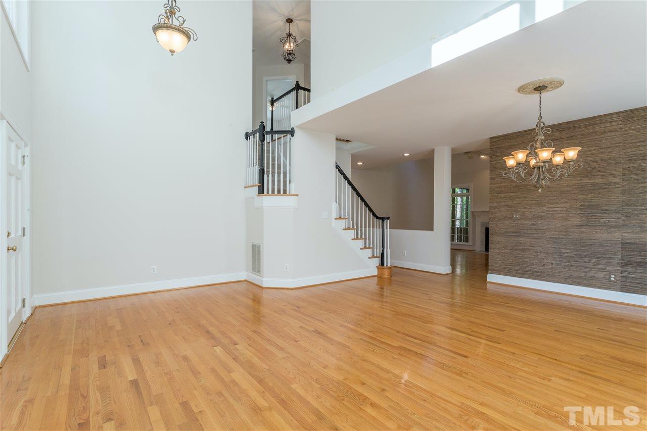 3305 Glade Spring Court Raleigh, NC 27612 - Photo 7 of 20 a view of empty room with wooden floor