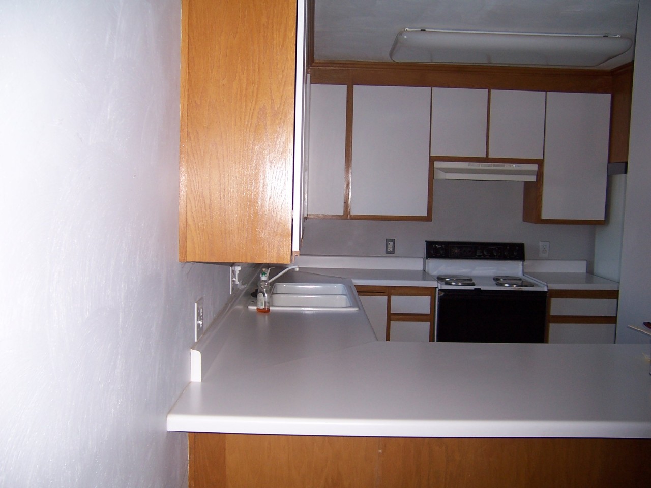 5523 Bore Auger Road Blue Ridge, VA 24064 - Photo 5 of 20 a kitchen with kitchen island a sink a stove and a microwave