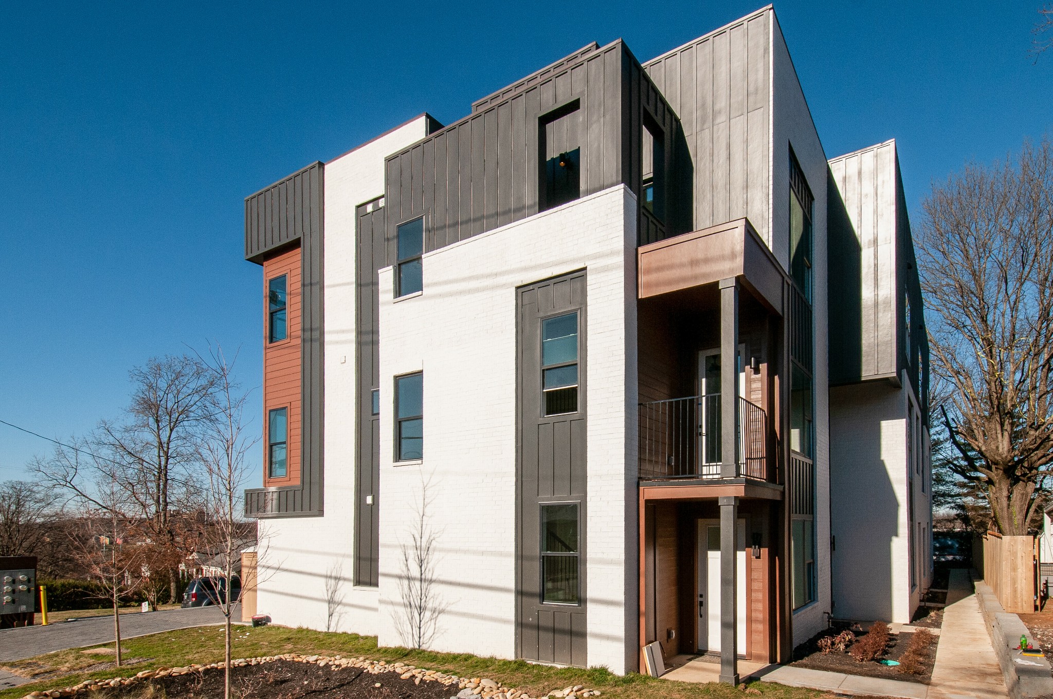 a view of a house with a door and wooden floor