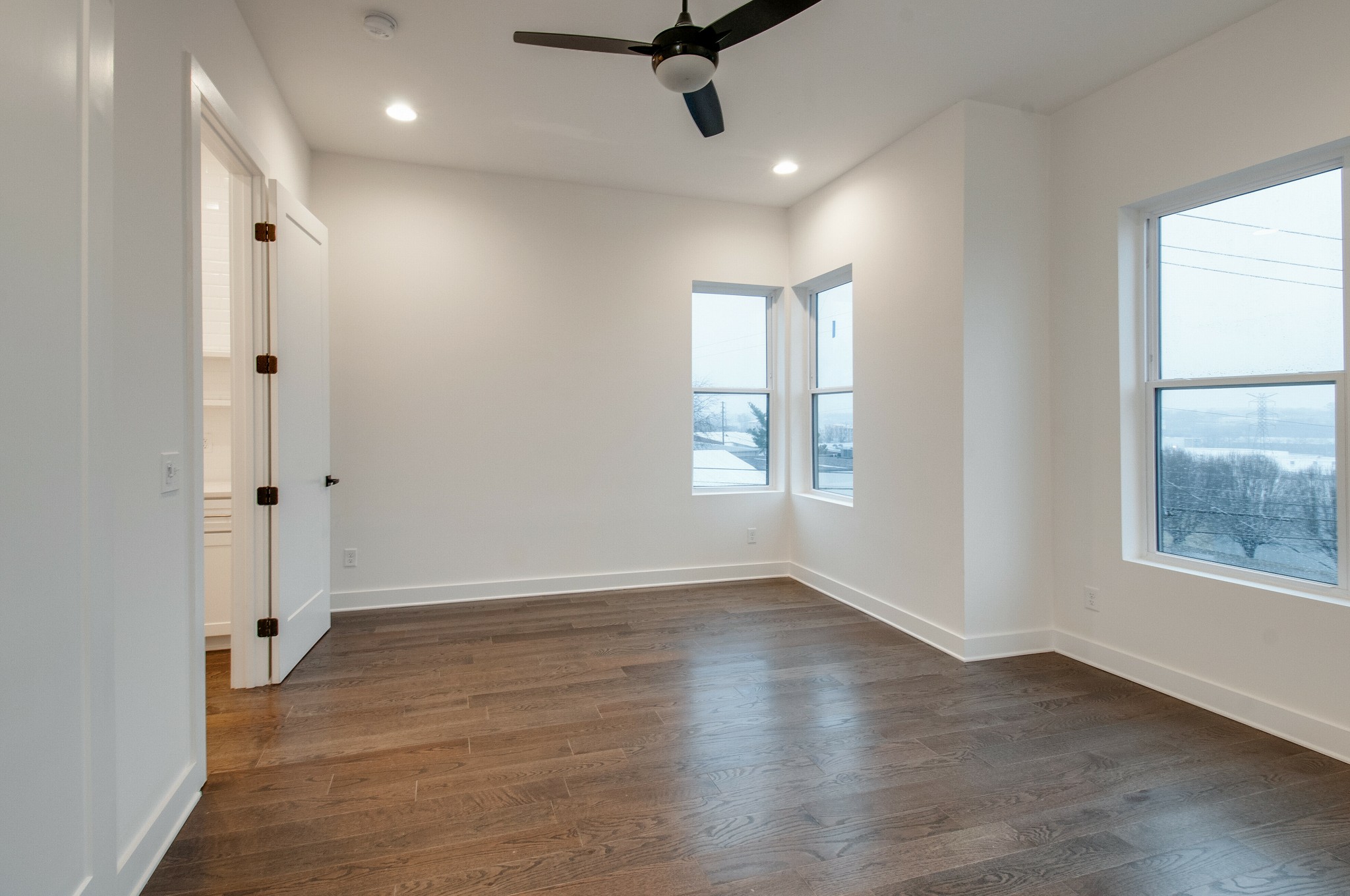 556 Rosedale Avenue, Unit 1 Nashville, TN 37211 - Photo 15 of 33 an empty room with wooden floor and windows
