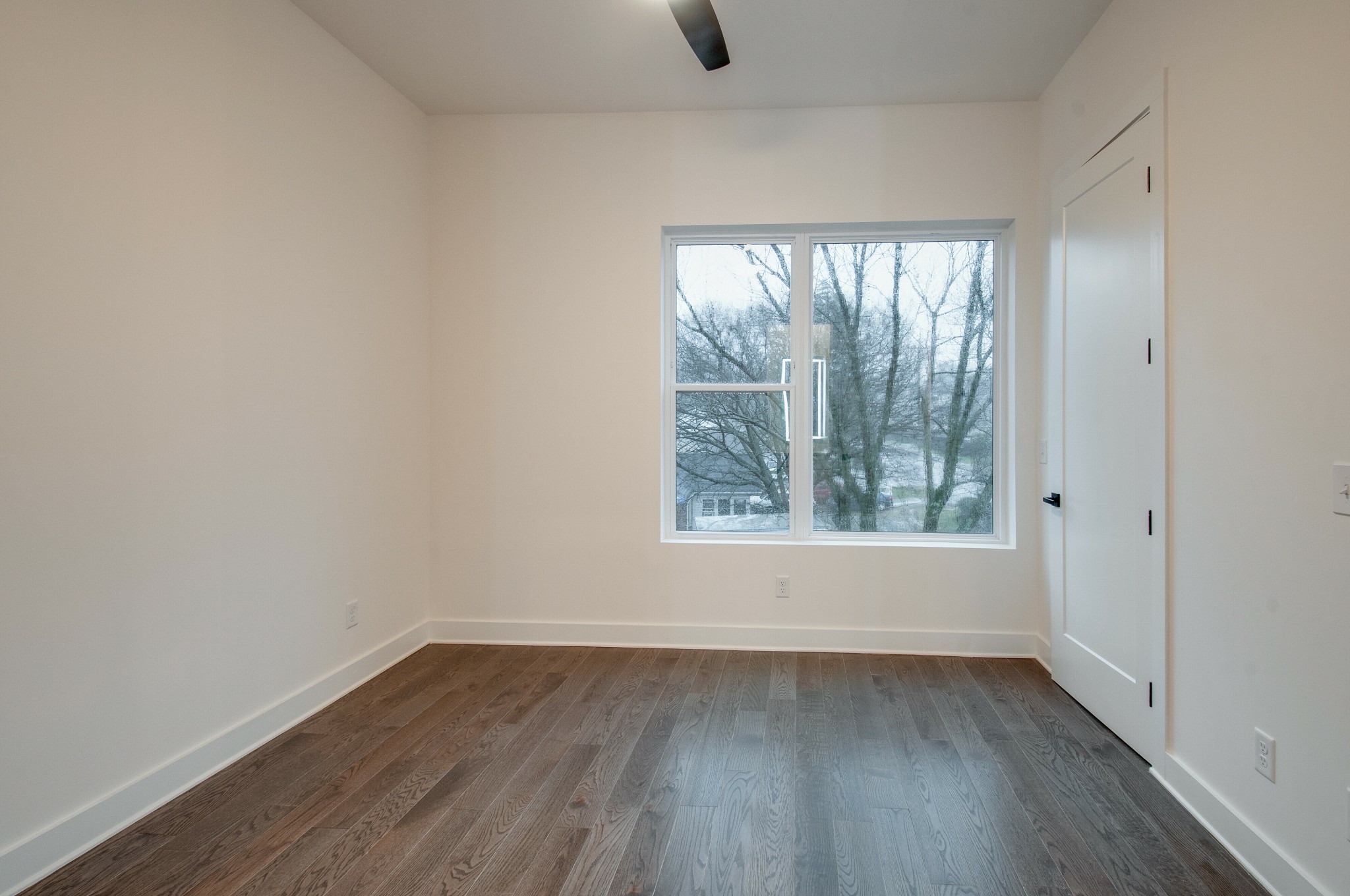 556 Rosedale Avenue, Unit 1 Nashville, TN 37211 - Photo 20 of 33 an empty room with wooden floor and windows