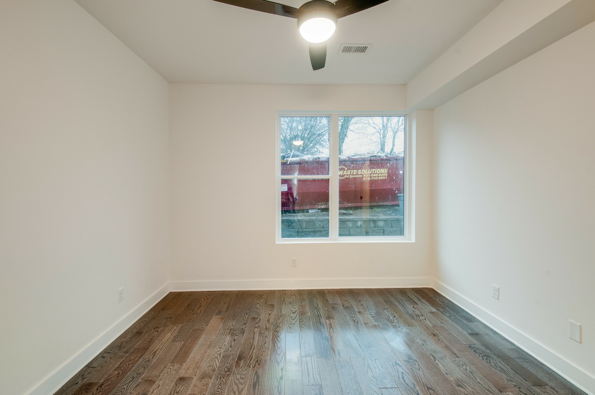 556 Rosedale Avenue, Unit 1 Nashville, TN 37211 - Photo 22 of 33 an empty room with wooden floor and windows