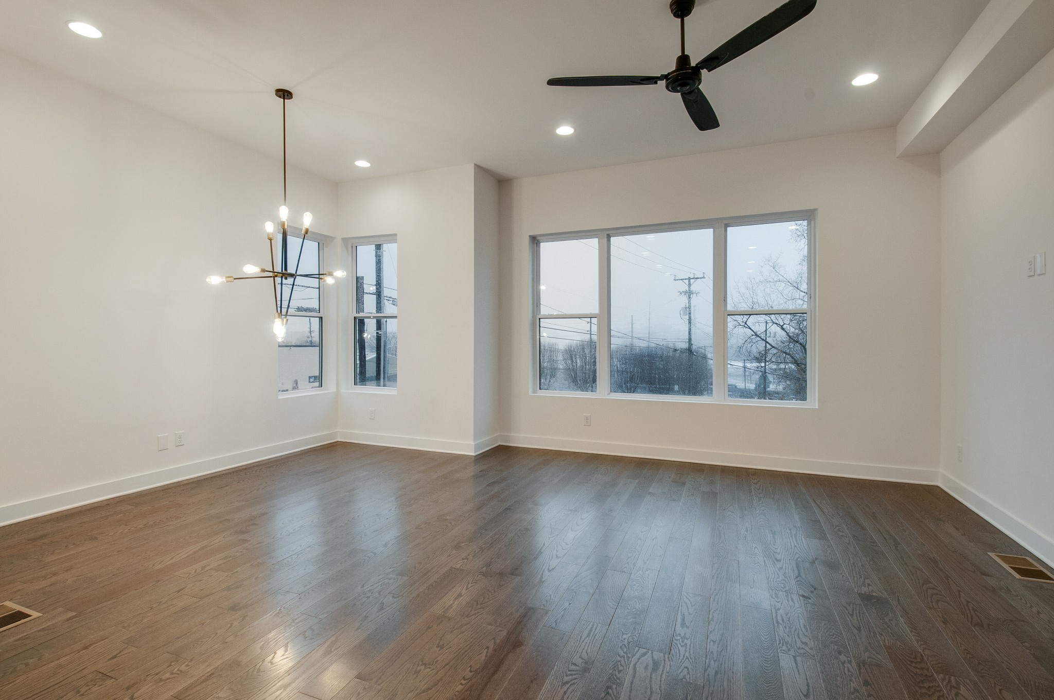 556 Rosedale Avenue, Unit 1 Nashville, TN 37211 - Photo 25 of 33 a view of an empty room with wooden floor and a window