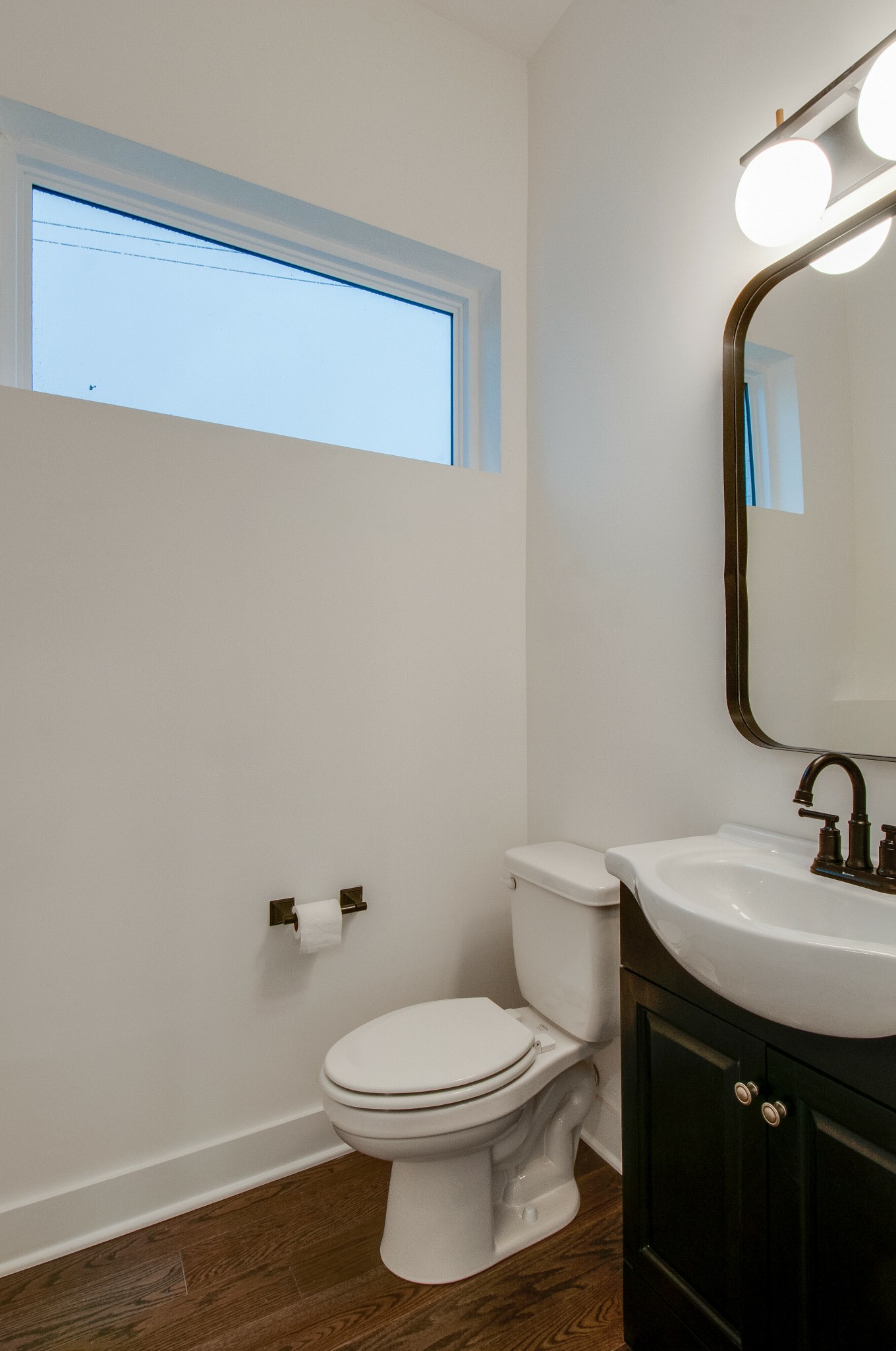 556 Rosedale Avenue, Unit 1 Nashville, TN 37211 - Photo 28 of 33 a bathroom with a toilet a sink and mirror
