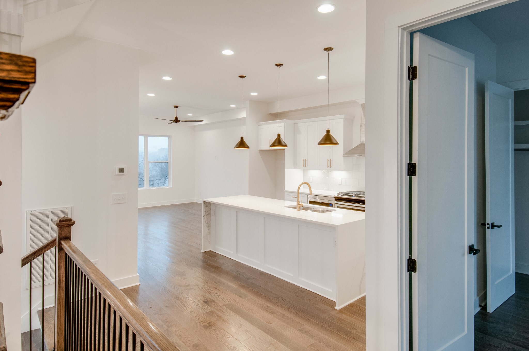 556 Rosedale Avenue, Unit 1 Nashville, TN 37211 - Photo 6 of 33 a view of a hallway with wooden floor and kitchen