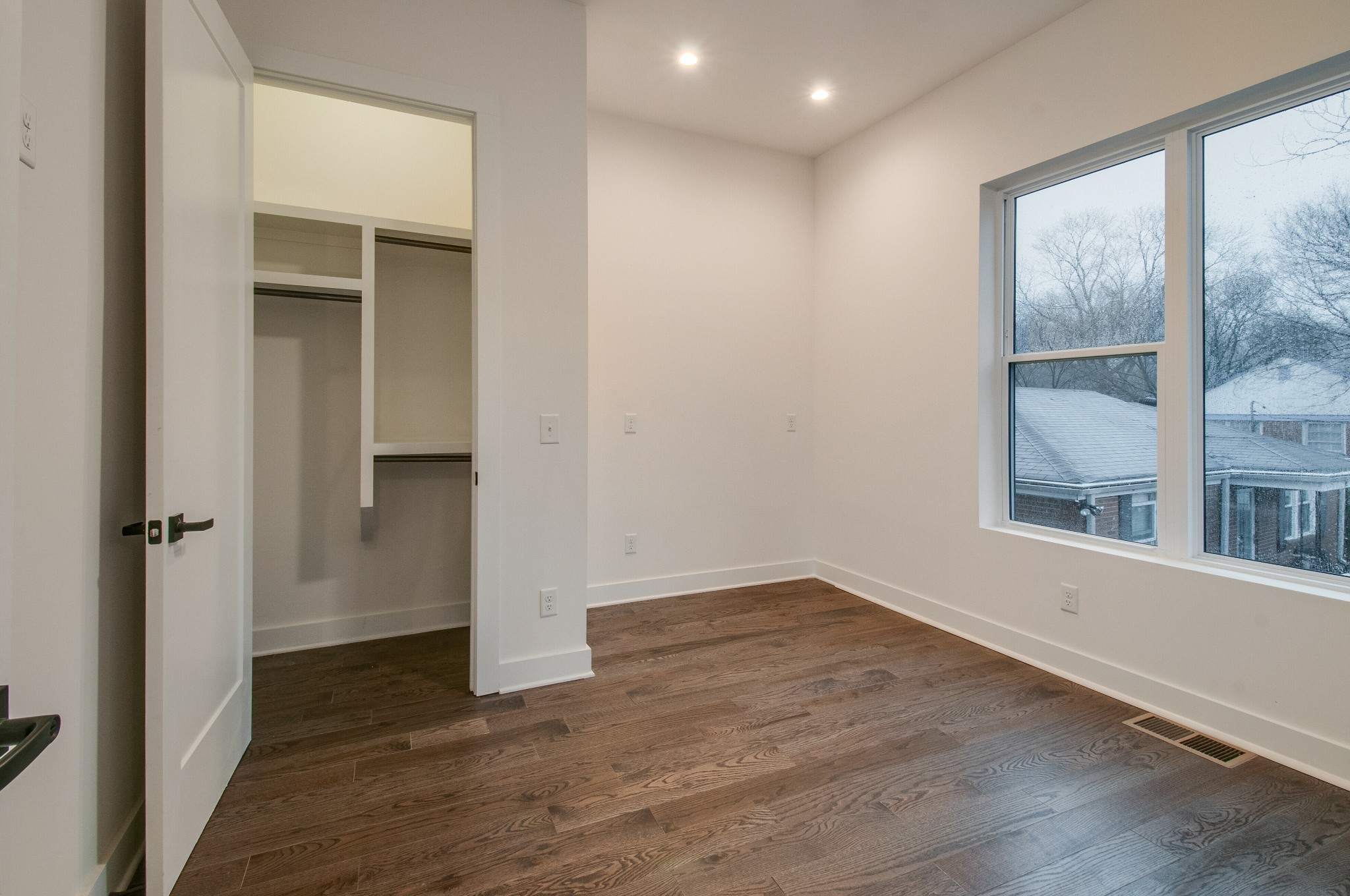 556 Rosedale Avenue, Unit 1 Nashville, TN 37211 - Photo 7 of 33 an empty room with wooden floor and windows