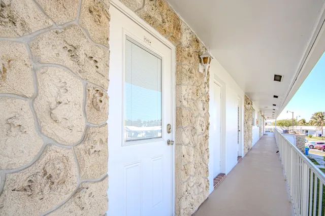 a view of a hallway with seating area