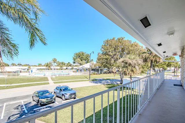 a view of a balcony and ocean view