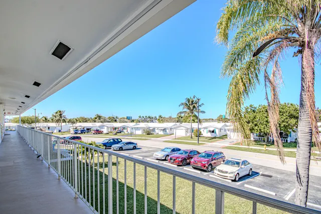 a view of a balcony and swimming pool