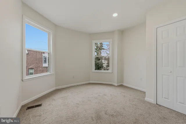 an empty room with windows