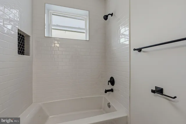 a bathroom with a bathtub