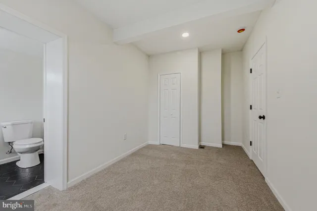a view of a bathroom with a toilet
