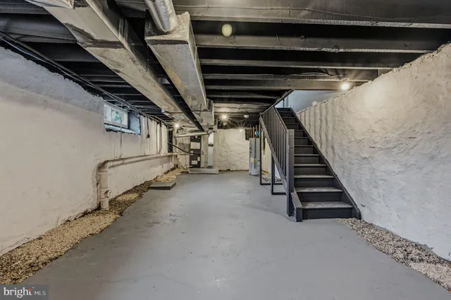 a view of an empty room with stairs