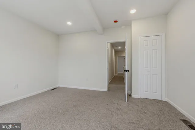 an empty room with a bathroom