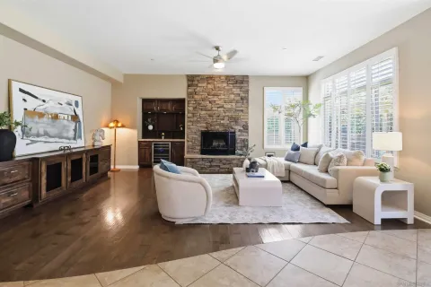 a living room with furniture kitchen view and a dining table