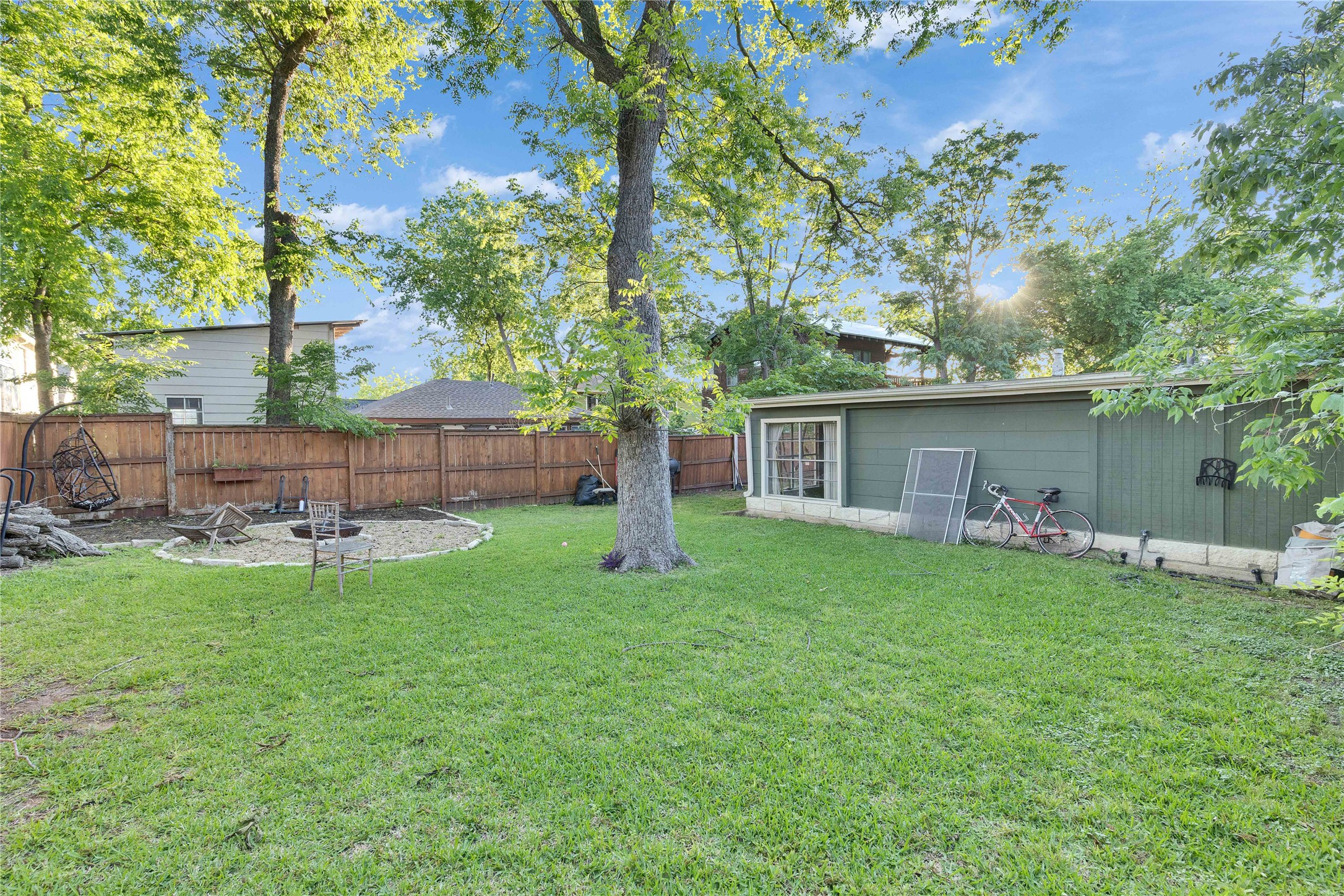 4607 Evans Avenue, Unit B Austin, TX 78751 - Photo 29 of 34 Expansive green lawn with a dedicated fire pit area
