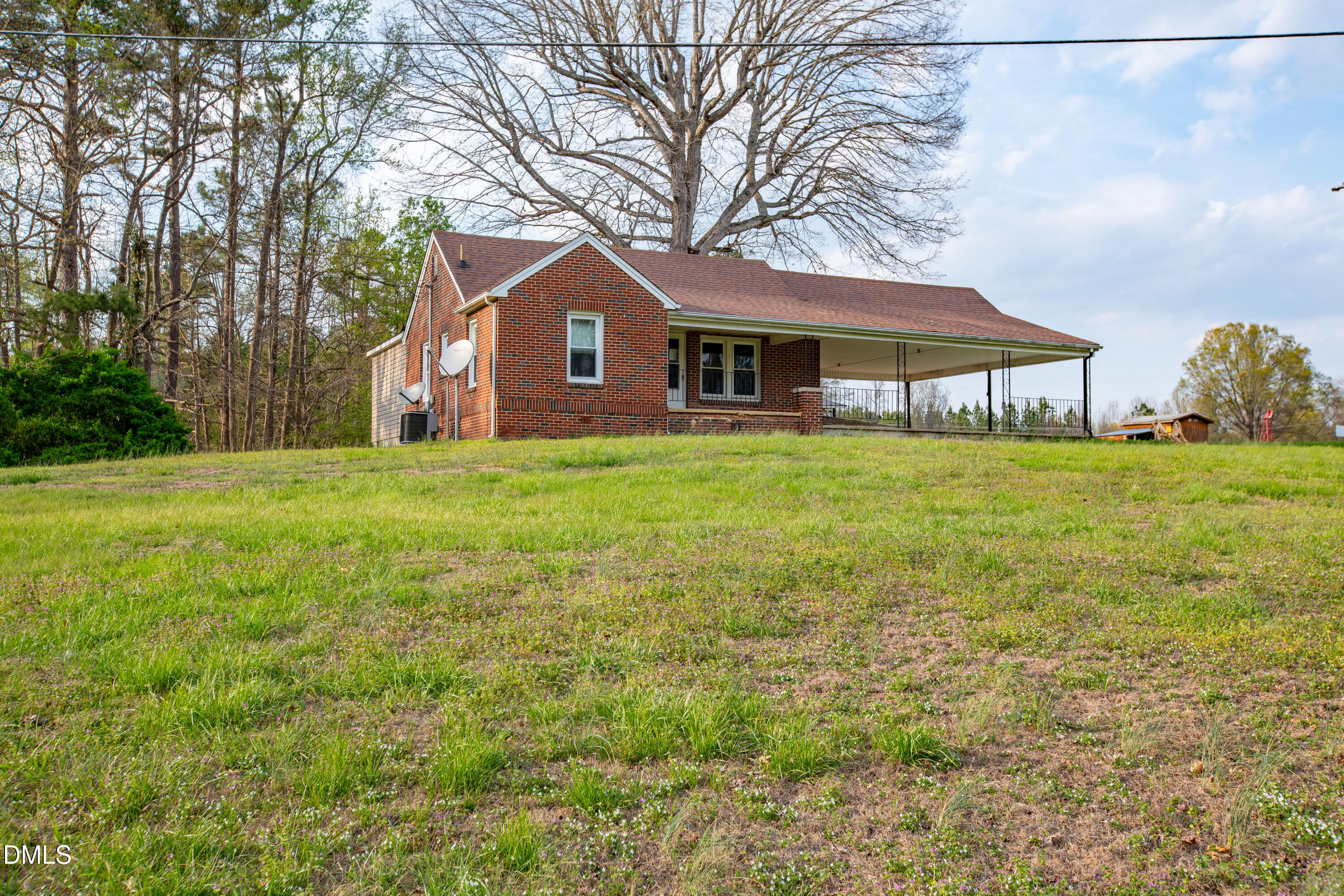 4295 Virgilina Road Roxboro, NC 27574 - Photo 3 of 46 a front view of a house with yard and green space