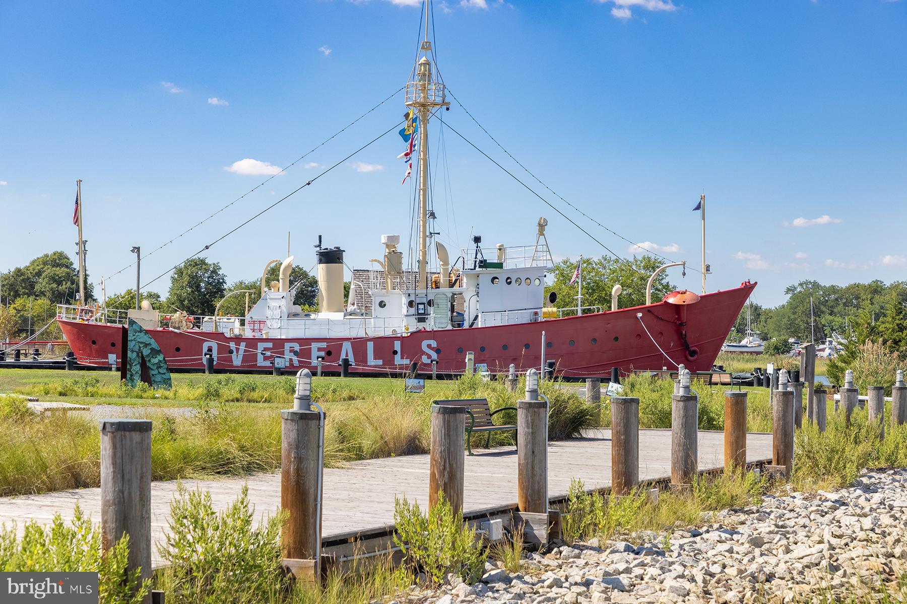 149 Jacks Way, Unit 18 Lewes, DE 19958 - Photo 11 of 26 a view of a swimming pool with a patio and lake view