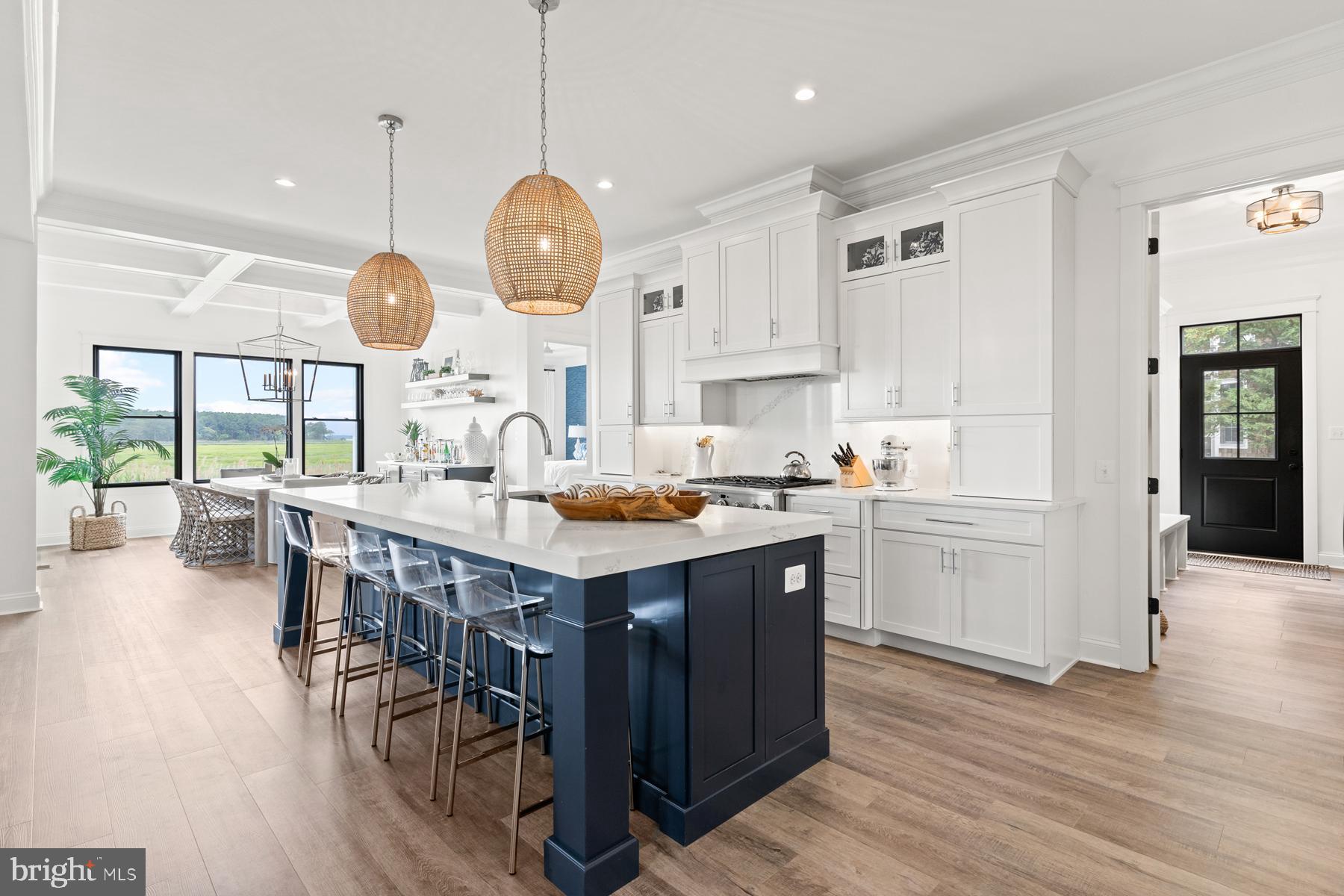 149 Jacks Way, Unit 18 Lewes, DE 19958 - Photo 8 of 26 a kitchen with a large island cabinets and wooden floor
