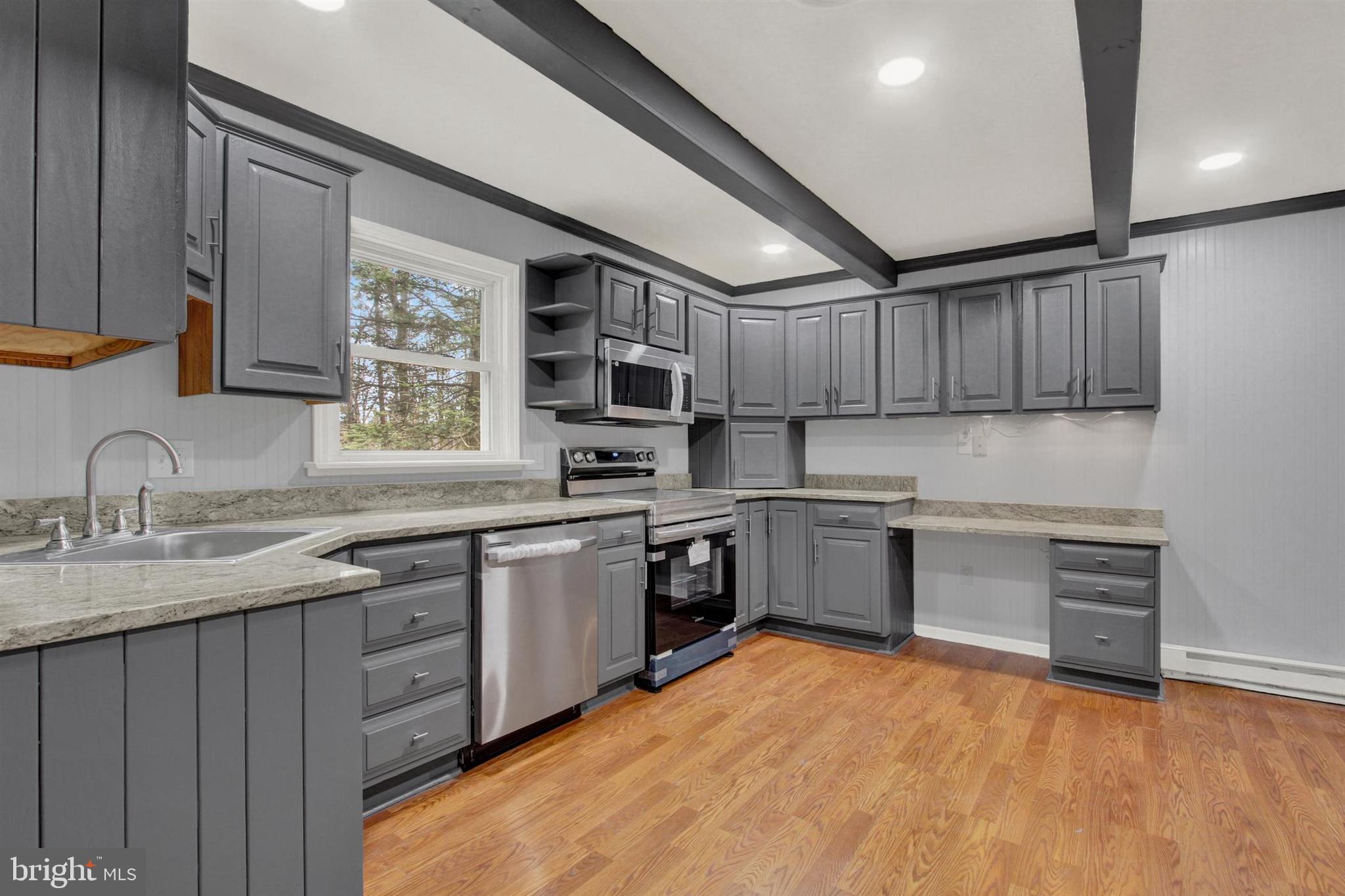 203 Pebble Lane Biglerville, PA 17307 - Photo 11 of 29 a kitchen with stainless steel appliances granite countertop a sink dishwasher stove and refrigerator