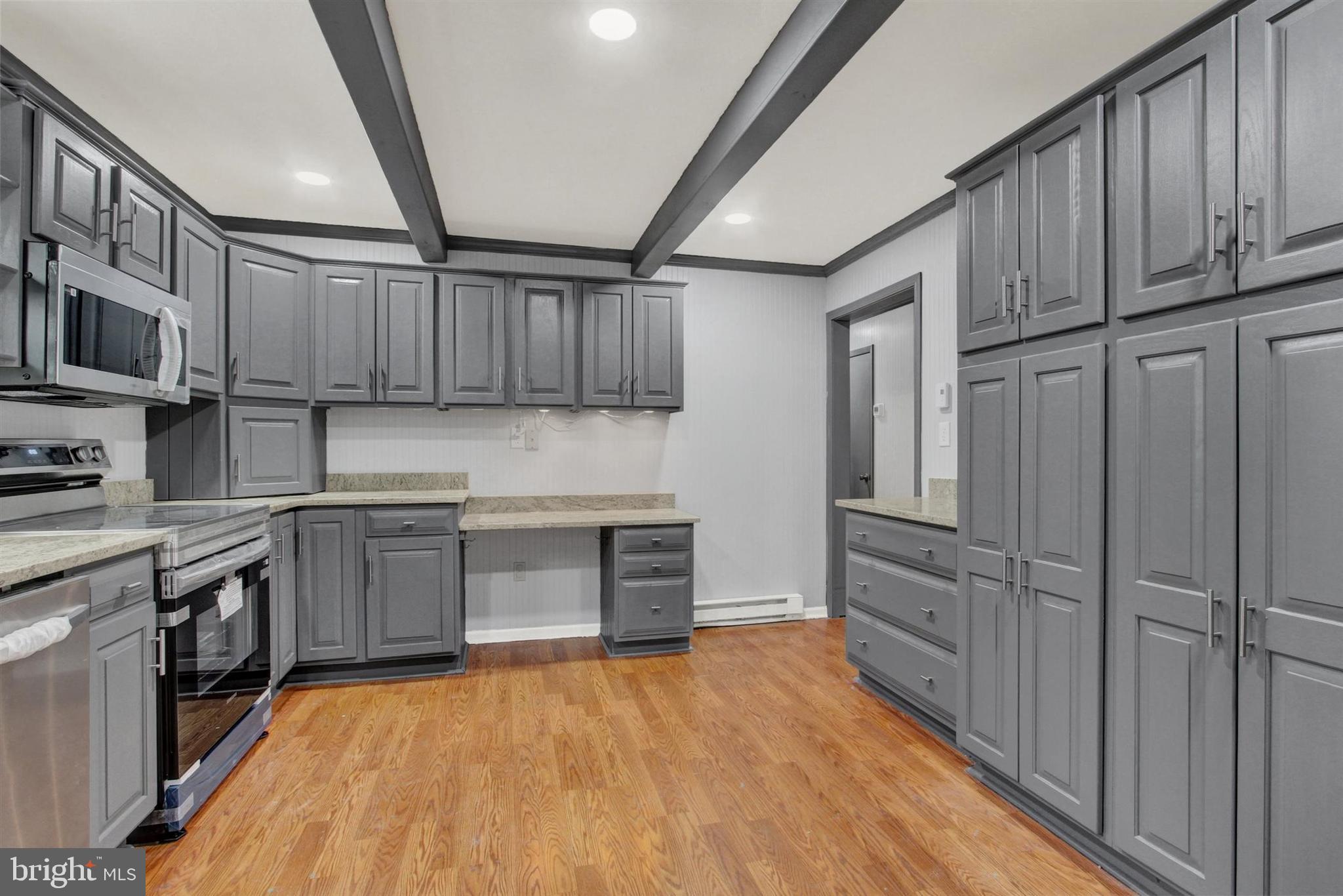 203 Pebble Lane Biglerville, PA 17307 - Photo 13 of 29 a kitchen with stainless steel appliances granite countertop a refrigerator oven a sink dishwasher and wooden cabinets with wooden floor