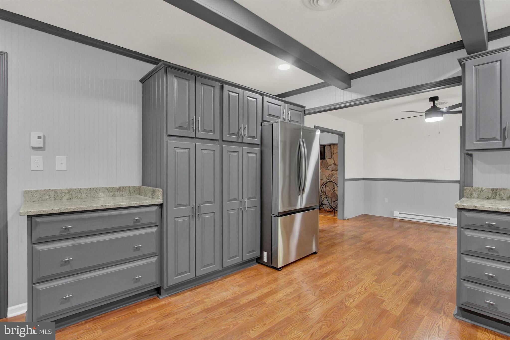 203 Pebble Lane Biglerville, PA 17307 - Photo 14 of 29 a view of an empty room with cabinet wooden floor and a cabinet