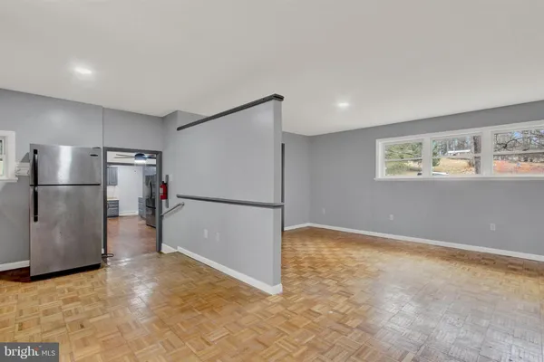 a view of kitchen with a refrigerator in it
