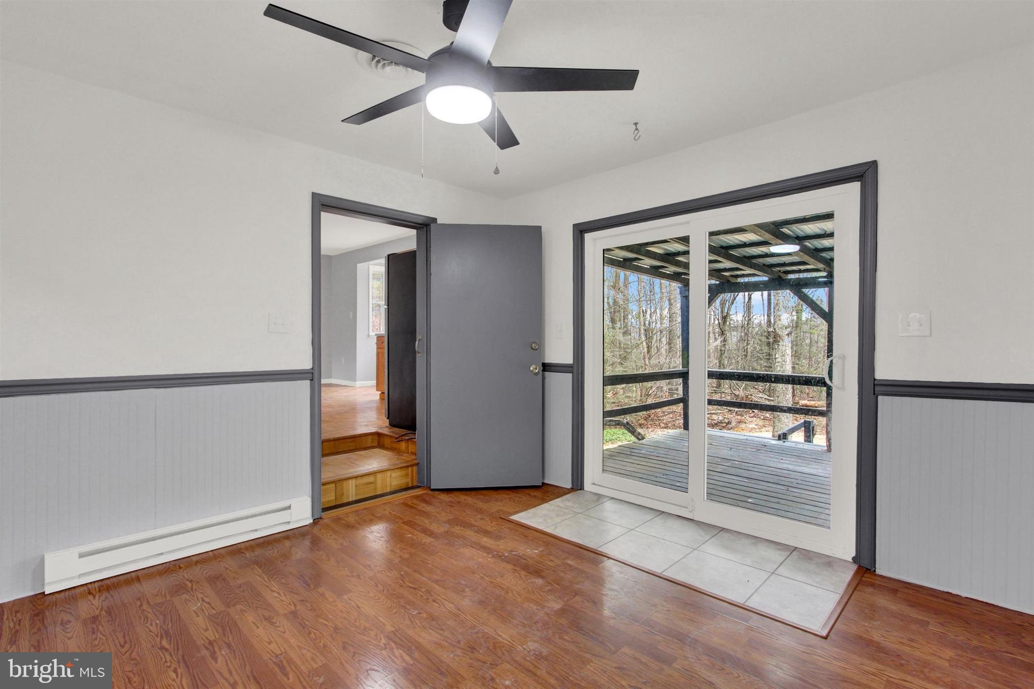 203 Pebble Lane Biglerville, PA 17307 - Photo 21 of 29 wooden floor in an empty room with a window