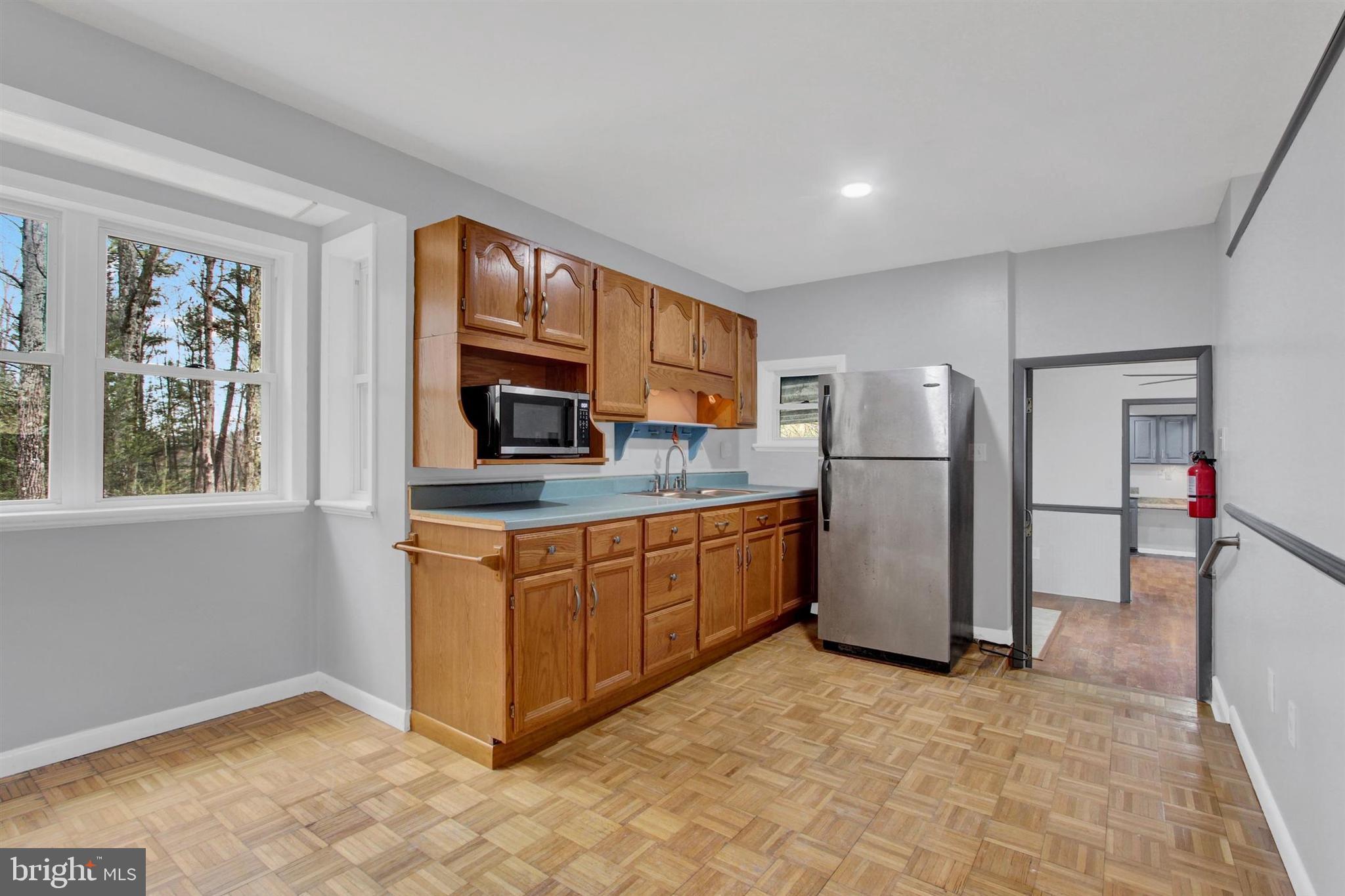 203 Pebble Lane Biglerville, PA 17307 - Photo 22 of 29 a kitchen with stainless steel appliances granite countertop a refrigerator and a stove top oven