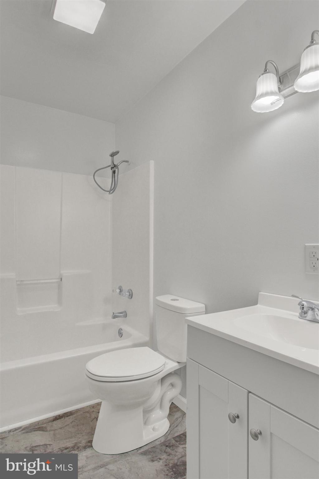 203 Pebble Lane Biglerville, PA 17307 - Photo 26 of 29 a bathroom with a sink a toilet and a bathtub