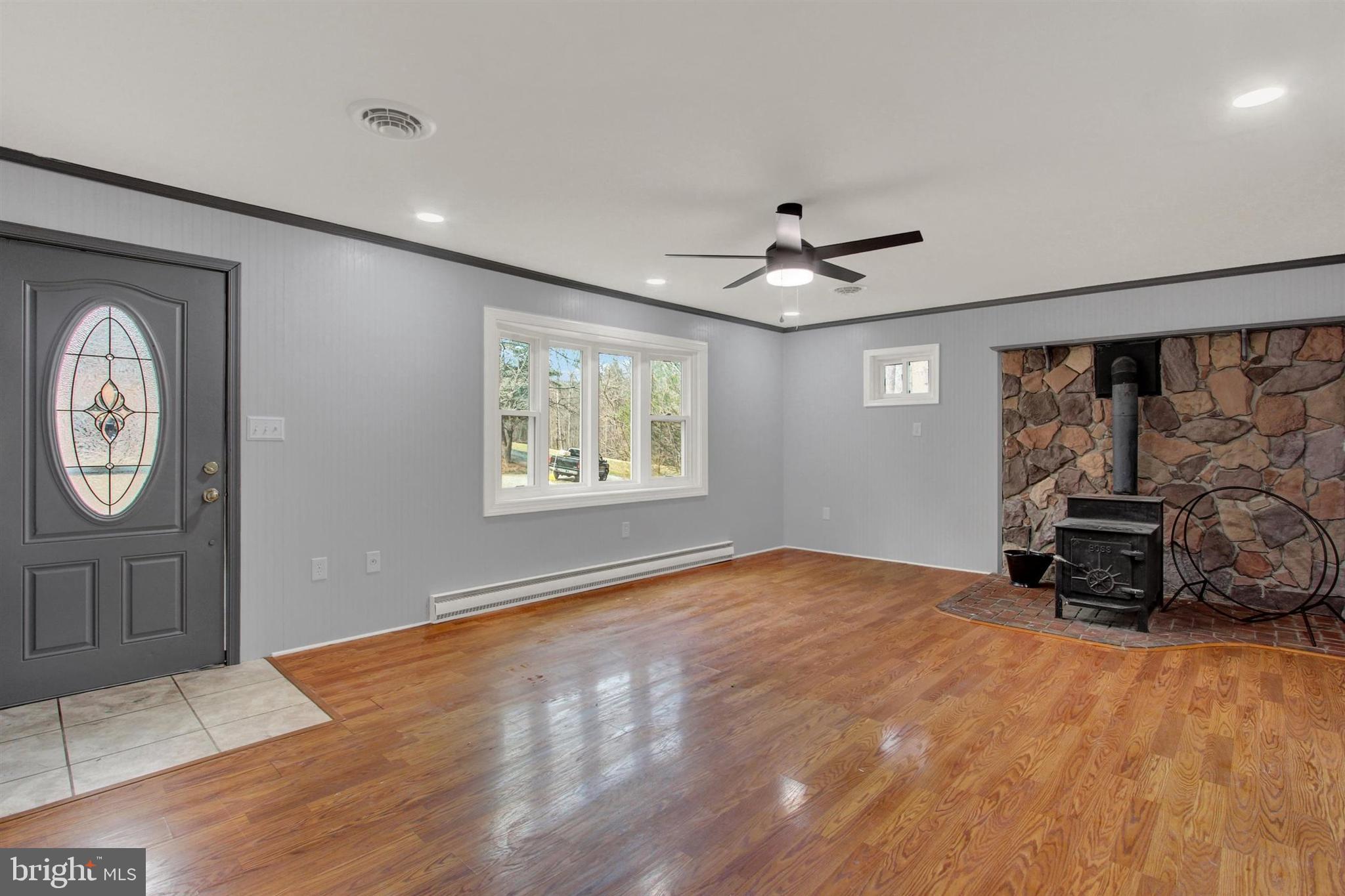 203 Pebble Lane Biglerville, PA 17307 - Photo 9 of 29 a view of livingroom with hardwood floor and a ceiling fan