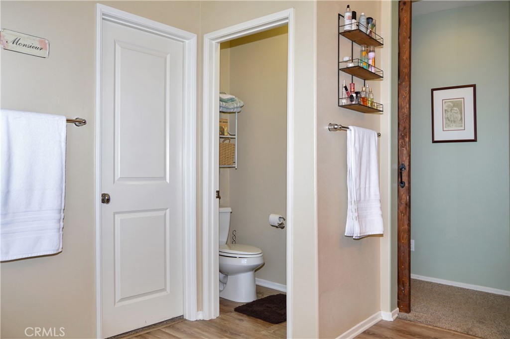 166 Fox Lane Calimesa, CA 92320 - Photo 40 of 76 Main Suite Bath with Dual Sinks, Soaking Tub, Glass-Enclosed Stall Shower, Private Toilet Room, and a Large Walk-in Closet