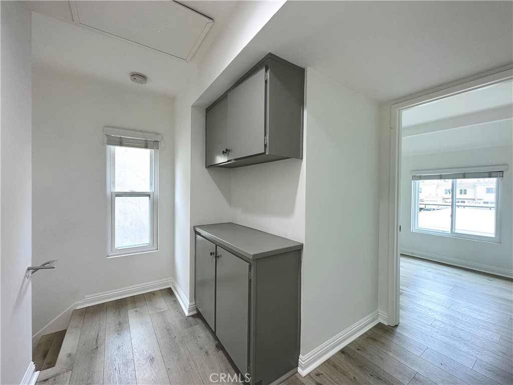 13 Greenleaf, Unit 5 Irvine, CA 92604 - Photo 19 of 30 an empty room with wooden floor and a window