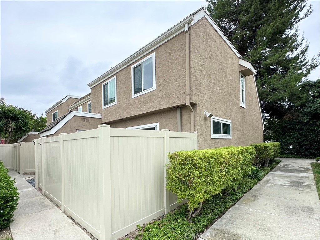 13 Greenleaf, Unit 5 Irvine, CA 92604 - Photo 29 of 30 a view of a house with a yard
