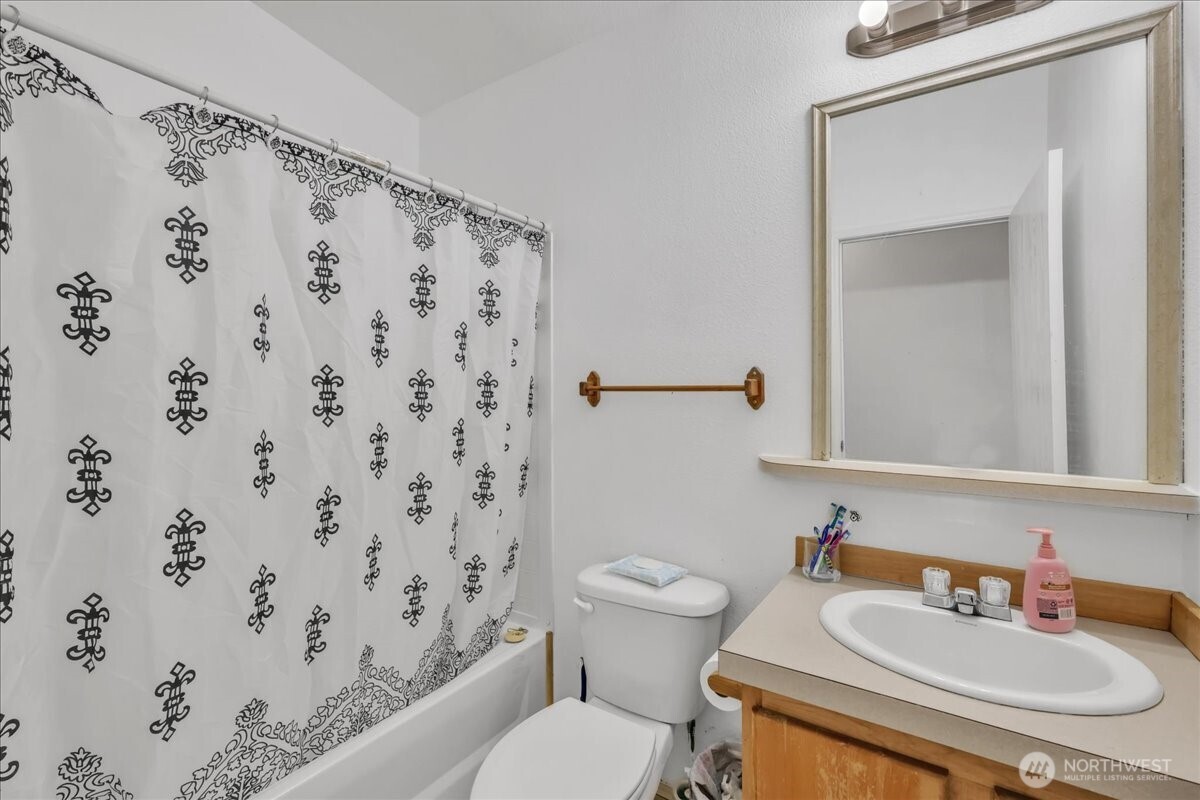 5 Cherokee Place Copalis Beach, WA 98535 - Photo 14 of 16 a bathroom with a sink toilet and shower