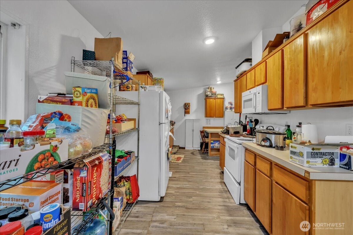 5 Cherokee Place Copalis Beach, WA 98535 - Photo 6 of 16 a kitchen with lots of white appliances