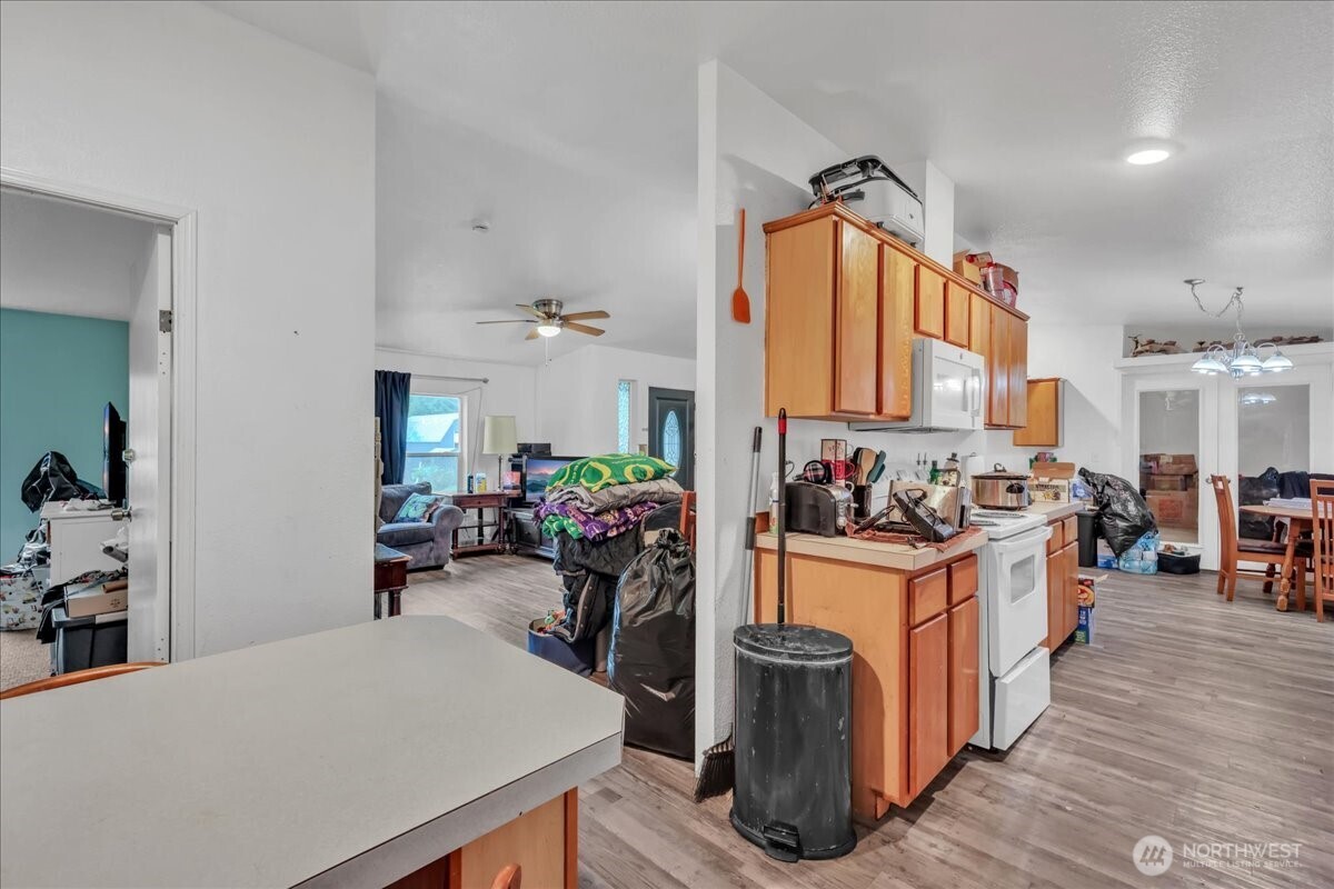5 Cherokee Place Copalis Beach, WA 98535 - Photo 8 of 16 a kitchen with a sink appliances and wooden floor