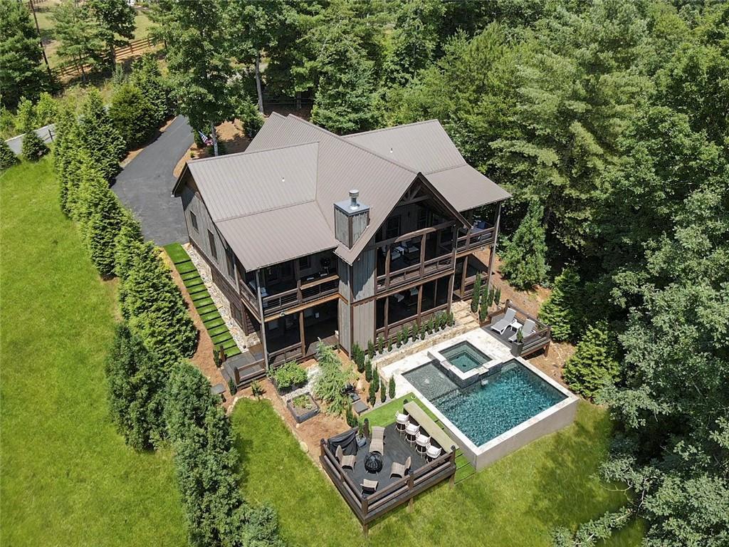 413 Staurolite Mountain Road Blue Ridge, GA 30513 - Photo 1 of 1 an aerial view of a house with a yard