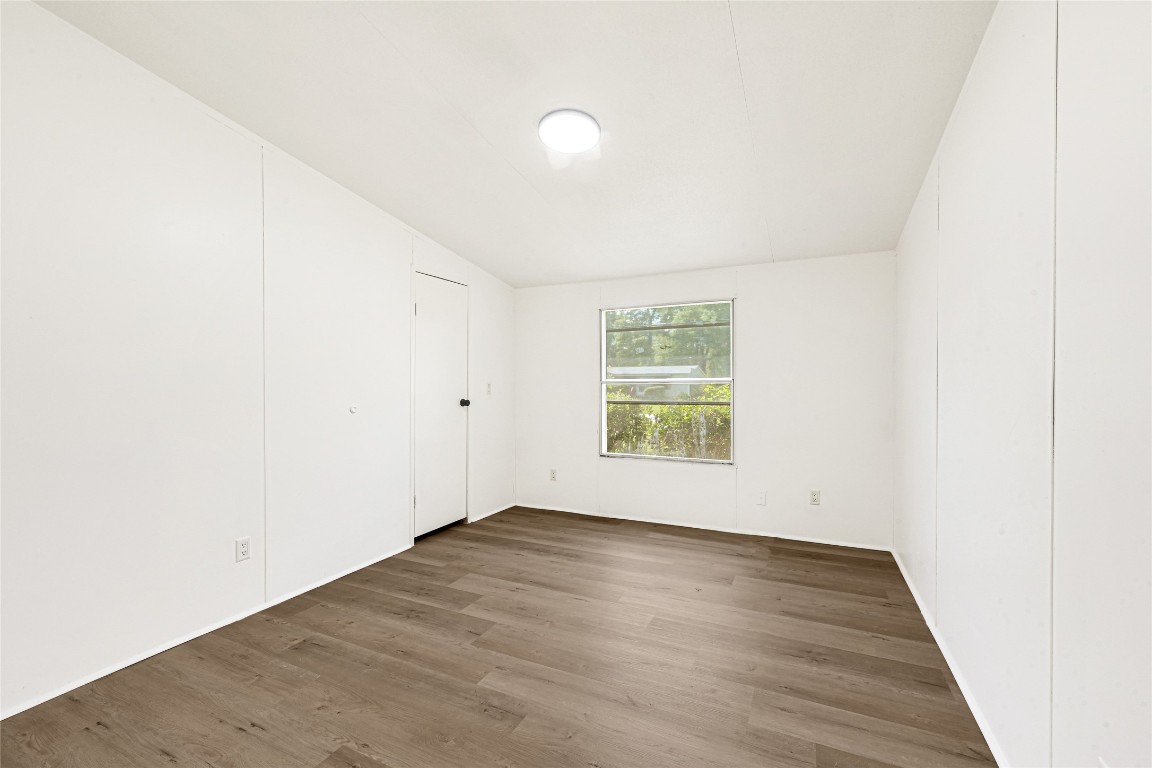 16315 Lone Star Ranch Drive Conroe, TX 77302 - Photo 15 of 20 an empty room with wooden floor and windows