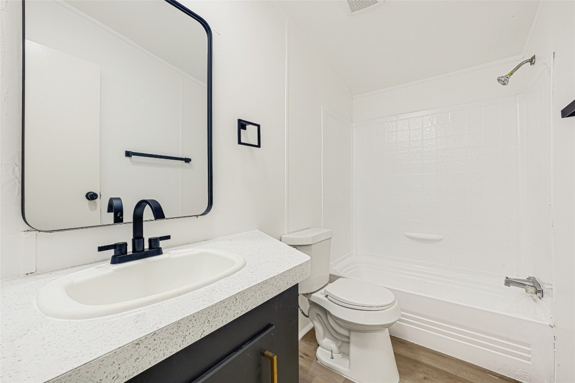 16315 Lone Star Ranch Drive Conroe, TX 77302 - Photo 17 of 20 a bathroom with a sink a toilet and shower