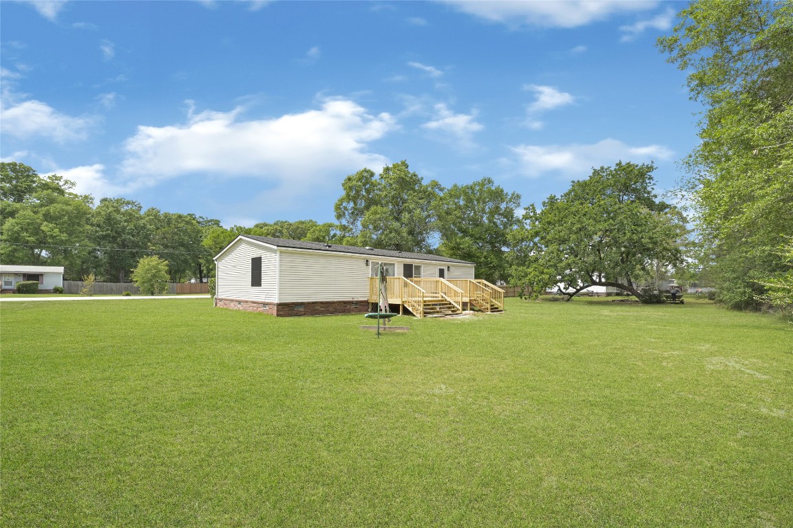 16315 Lone Star Ranch Drive Conroe, TX 77302 - Photo 5 of 20 a house view with swimming pool and garden