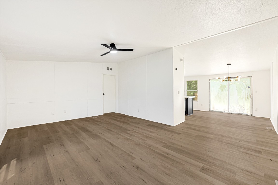 16315 Lone Star Ranch Drive Conroe, TX 77302 - Photo 7 of 20 a view of empty room with wooden floor and fan