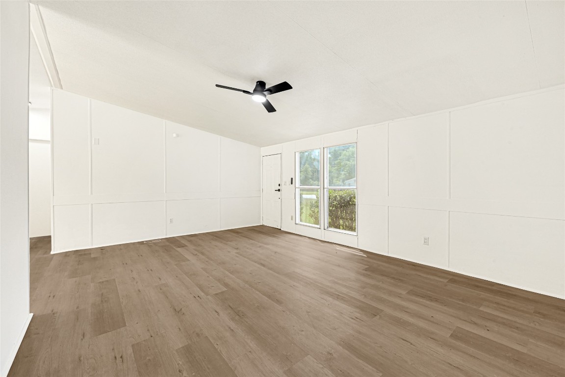 16315 Lone Star Ranch Drive Conroe, TX 77302 - Photo 8 of 20 an empty room with wooden floor and windows
