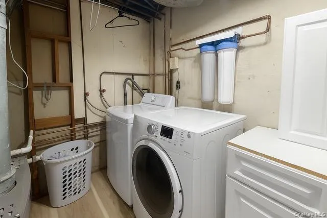 a utility room with dryer and washer