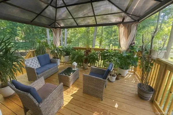 a outdoor living space with furniture and garden view