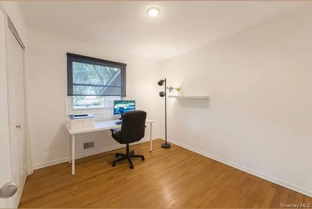 a workspace with furniture and a window