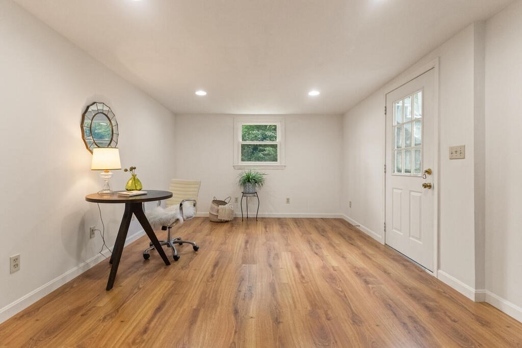 15 1/2 Algonquin Road Canton, MA 02021 - Photo 17 of 37 a view of a livingroom with furniture and wooden floor