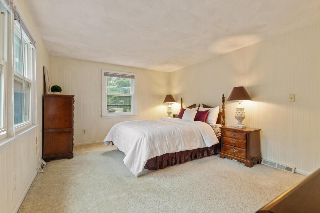 15 1/2 Algonquin Road Canton, MA 02021 - Photo 21 of 37 a spacious bedroom with a bed and a window