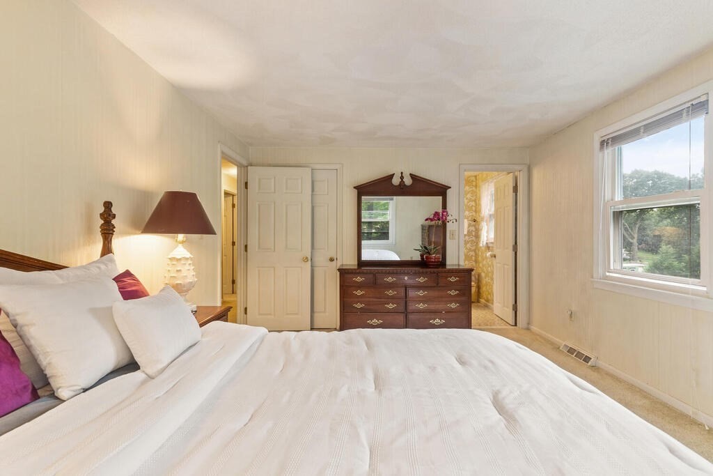 15 1/2 Algonquin Road Canton, MA 02021 - Photo 23 of 37 a bedroom with a bed and wooden floor