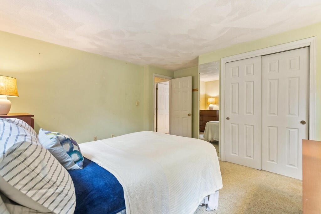 15 1/2 Algonquin Road Canton, MA 02021 - Photo 27 of 37 a bedroom with a bed and a walk in closet